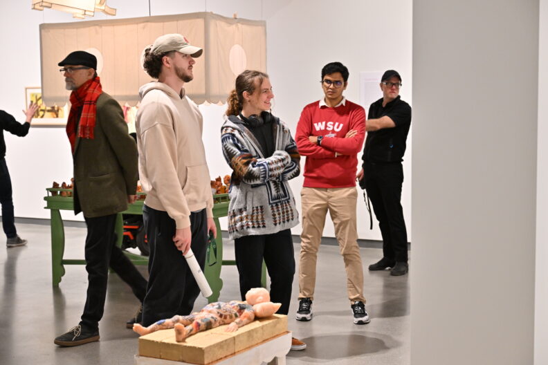 Image of museum visitors enjoying the Faculty Remix Exhibition Reception on 01/16/25