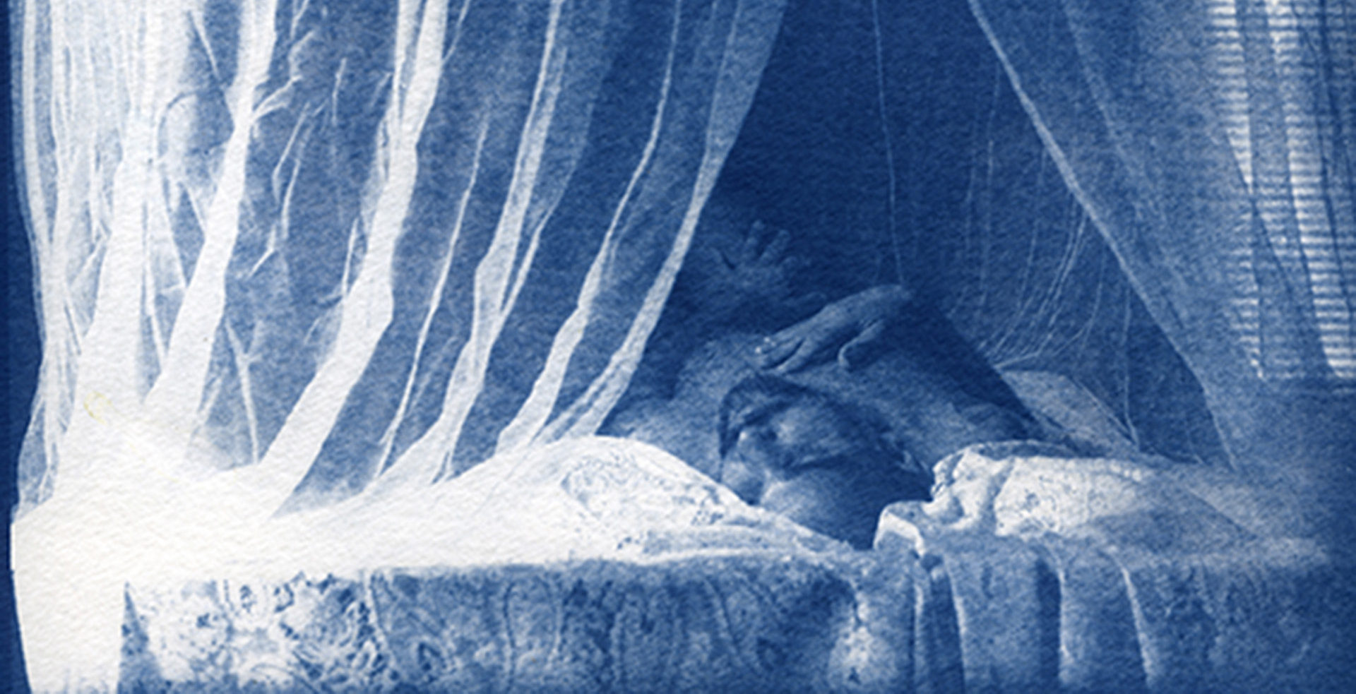 Cyanotype of figure on bed