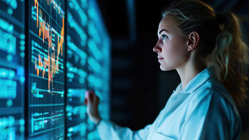 A focused scientist examines digital data on a high-tech screen,