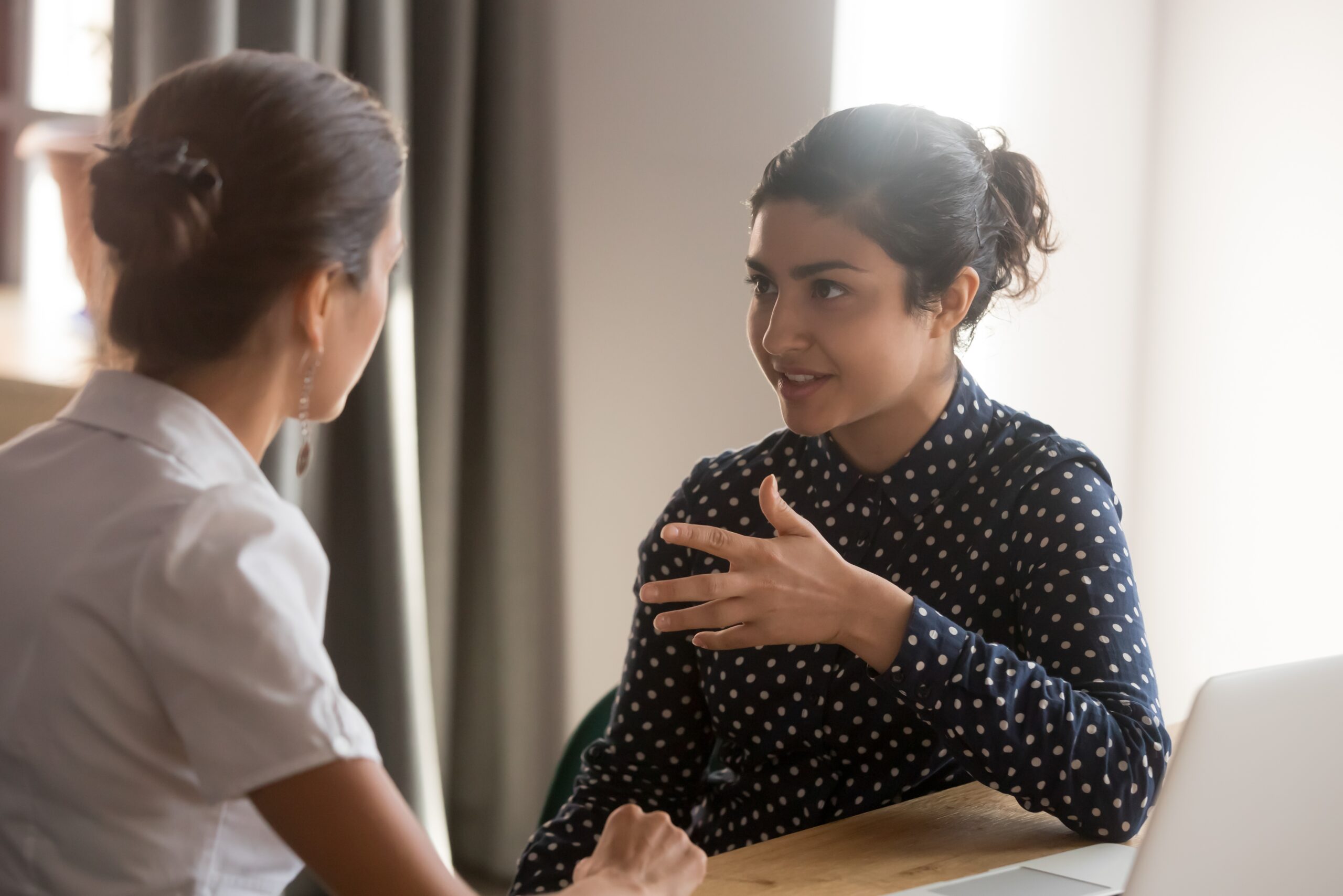 Latinx women in discussion.