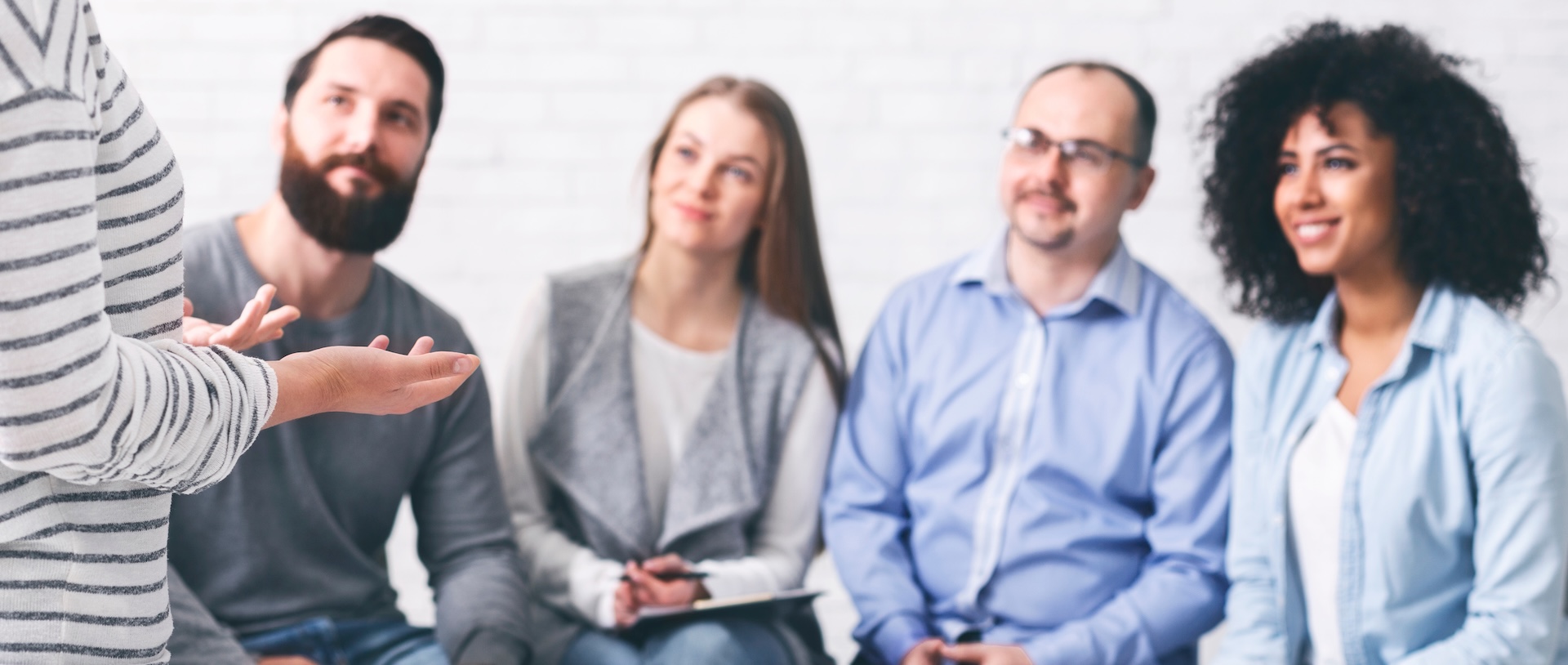 Behavioral health. Support group meeting. Woman sharing her feelings with listeners.