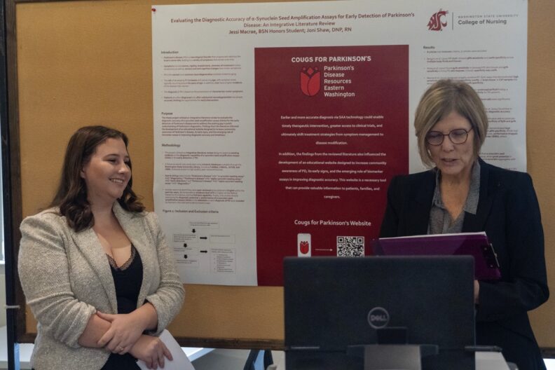 Honors student presenting their research during the Fall Honors Research Symposium.