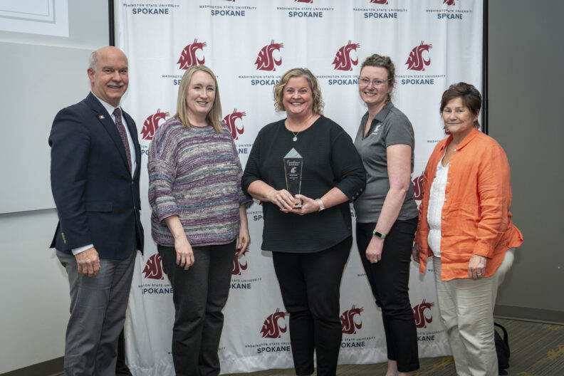 Chancellor Daryll DeWald, Anne Mason, Associate Dean of Academic Affairs, Heidi Belcher, Undergraduate Student Onboarding Coordinator, Laura East-Pease, Director of Clinical Affairs, and Dean Mary Koithan at the 2025 Chancellor's Excellence Awards.