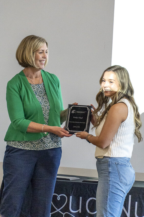 Outstanding BSN Student award presented to Emily Lloyd by Dr. Tiffanie Rampley