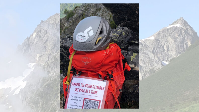 The Coug Climber's helmet and backpack displaying the promotional sign encouraging the support of the WSU College of Nursing.
