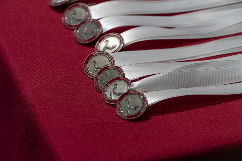 Nursing pins: signifying a nurse's completion of education and entry into the profession, representing dedication, school legacy.