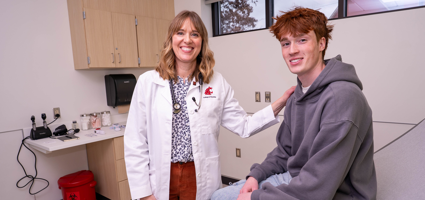 DNP healthcare professional with a youth patient.