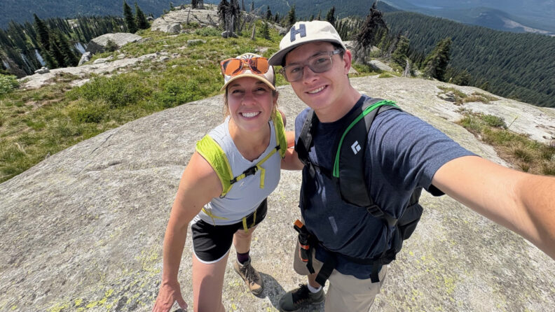 Zibby Merritt, MN ’19, BSN, with her son, at the top of a peak during a summer hike.