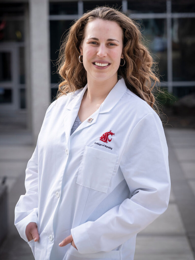 Audra Podruzny, BSN ’12, DNP ’26, RN, outside of the WSU College of Nursing in Spokane. Photo: Cori Kogan.