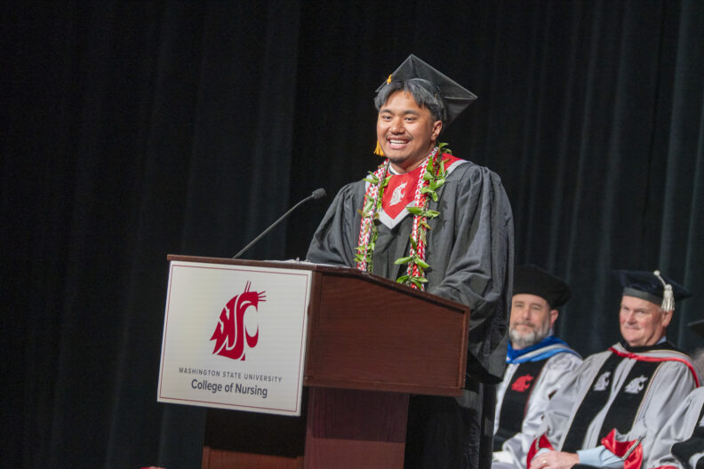 Spokane student speaker, Ty Vaeena, BSN ’26, during the 2026 Spring Commencement and pinning.