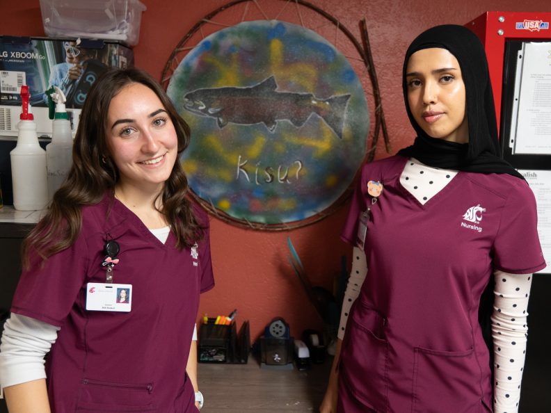 Nursing students Esther Roeber and Shorooq Al Amri at the Salish School of Spokane. Photo: Brad Schwartz, WSU College of Nursing.