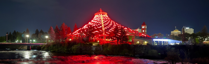 Night time view of the Spokane Pavilion lit up with red lights for Nurses Week 2026. Photo: Brad Schwartz, WSU College of Nursing.