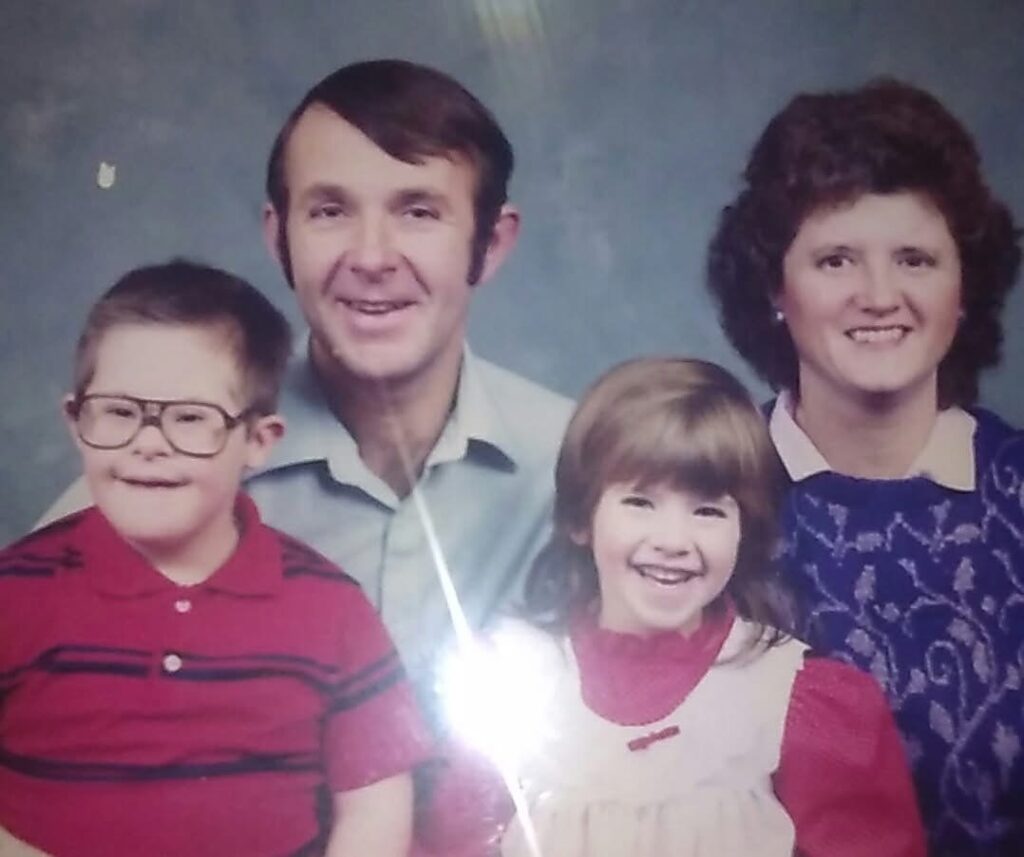 Judy (top right) with her husband John (top left) and some of their children.
