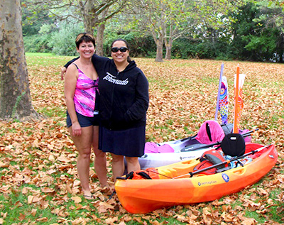 Sue Gilchrist (l) and Ke-Niah-Kiw "Kay Kay" Weso with their watercraft.