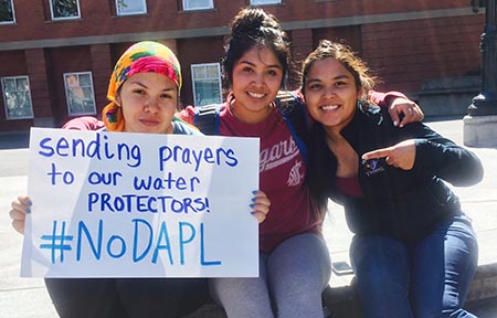  Elsie Cree, Kyra Antone, and Jazmine Ike-Lopez show their support for Standing Rock on the WSU Terrell Mall.