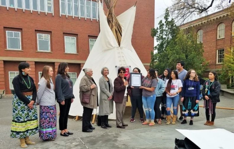 Group in front of tipi on Terrell Mall