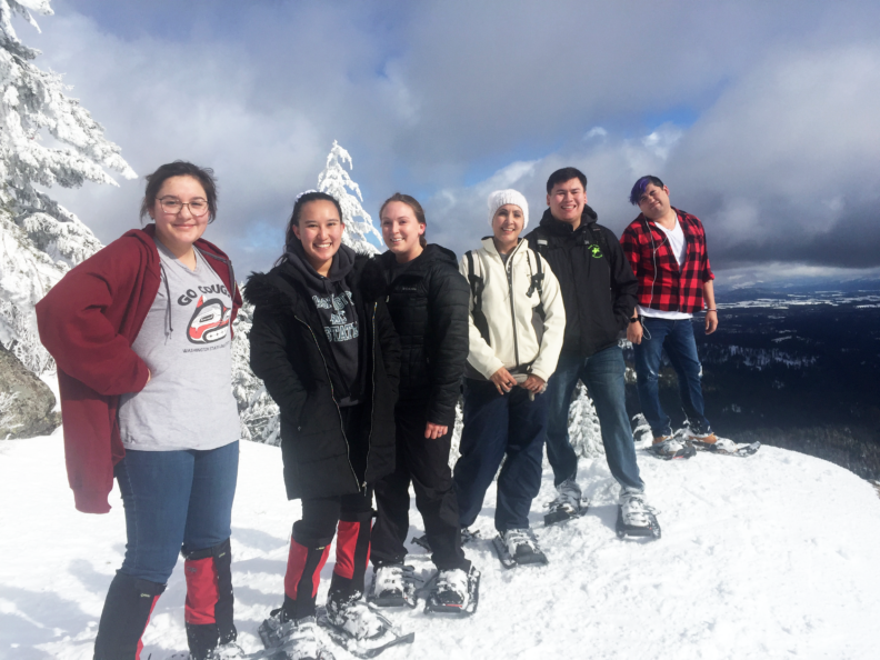 The snowshoeing crew pausing for a photo at the top of the East Peak of Moscow Mountain.