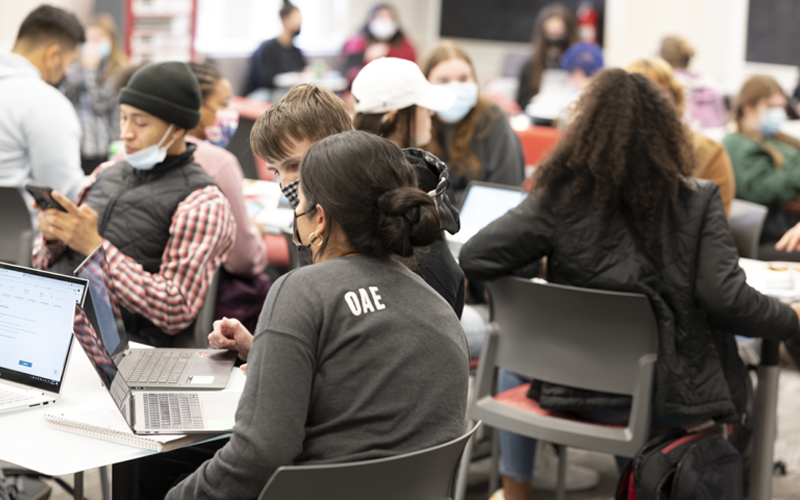 An OAE staff member answers a student's questions about filling out a FAFSA application.