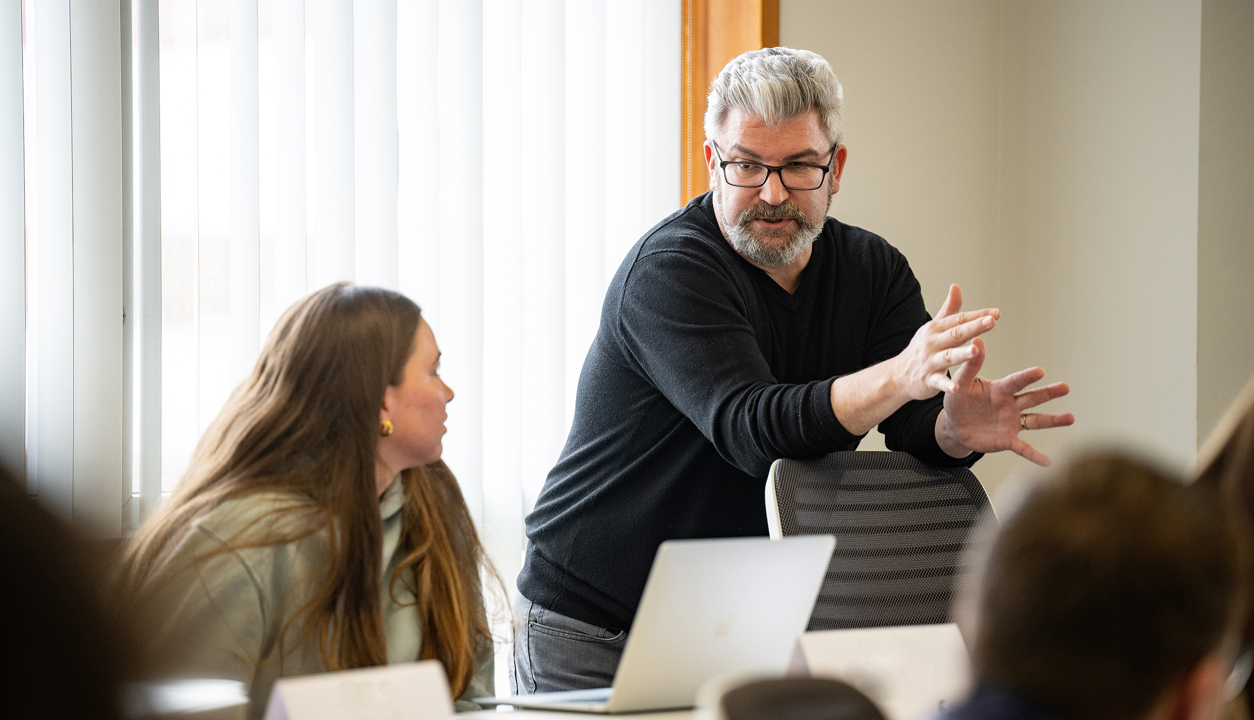 Carson College of Business professor Chris Cooney teaches students during BA100.