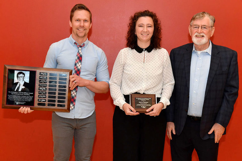 Kara M. Whitman takes a celebratory photo with Clif Stratton and Dick Law after receiving the Richard G. Law Excellence Award for Undergraduate Teaching.