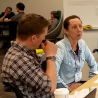 Teaching academy members meeting together to collaborate.