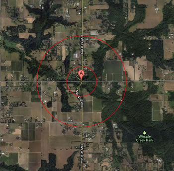 the site is noted by a red mark. A red circle is centered around it, and a larger red circle is around the outside of that.