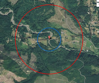 the same land area as is shown in the map above. the red circle on the outside shows the extent with a smaller blue circle inside it, around a red location marker at the center.