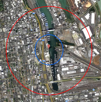 the same land area as is shown in the map above. the red circle on the outside shows the extent with a smaller blue circle inside it, around a red location marker at the center.