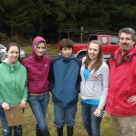 four people posing for a picture