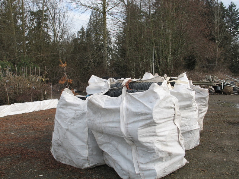 soil bags filled with used pots