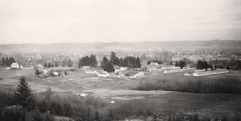 Western Washington Experiment Station fields and buildings. Puyallup Valley background.