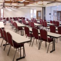 Narrow tables arranged in ranks for presentation.