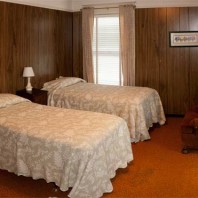 Small bedroom with two single beds.