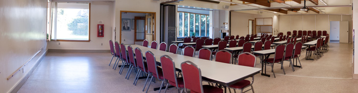 D.F. Allmendinger Center with tables arranged for a presentation.