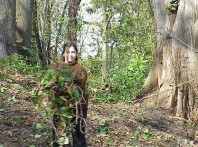 Clearing ivy from the site.