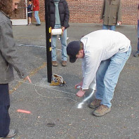 Marking the area where asphalt is to be removed and beds added.