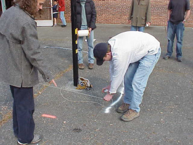 Marking the area where asphalt is to be removed and beds added.