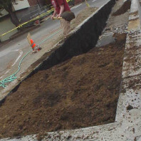 Filling the educational bed with soil.