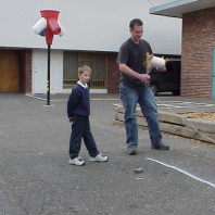 Marking the area where asphalt is to be removed and beds added.