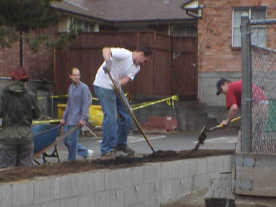 Filling the educational bed with soil.