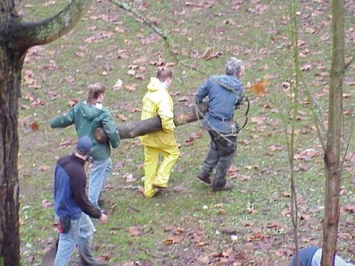 Moving and installing woody debris and terracing material.