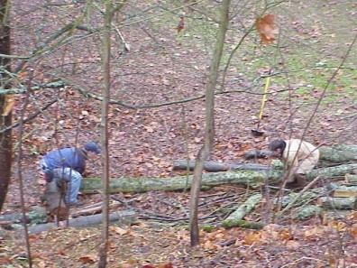Moving and installing woody debris and terracing material.