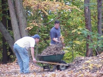 Loading wood chips to spread throughout the site.