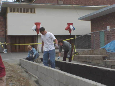 Moving construction rubble from the educational bed.