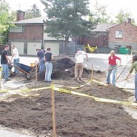 Building raised planting mounds in the big bed.