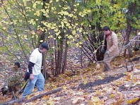 Moving and installing woody debris and terracing material.
