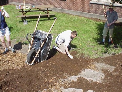Installing stairs to replace a social path.