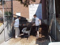 Loading mulch to apply to the site.