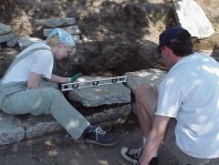 Checking to make sure the wall is level.