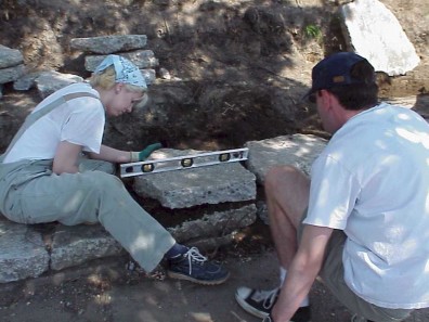 Checking to make sure the wall is level.